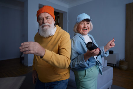 Senior couple wearing trendy fashion outfit with youth clothing styleの写真素材