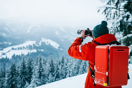 A dedicated hiker skillfully capturing the stunning beauty of snow-covered mountains while wearing winter gear. Generative AIの素材