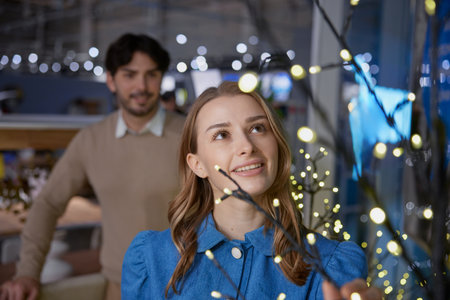 A joyful and festive family moment captured beautifully by the Christmas tree settingの写真素材