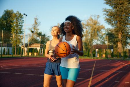 Happy joyful woman sharing impression after basketball game sessionの写真素材