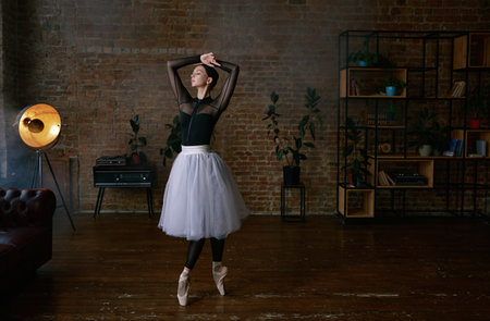 An elegant ballet performance in a modern studio showcases artistry and grace in every moveの写真素材