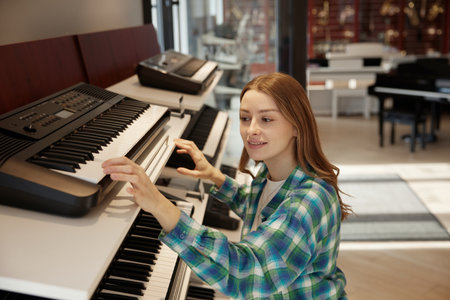 A woman extending her arm to reach for a keyboard