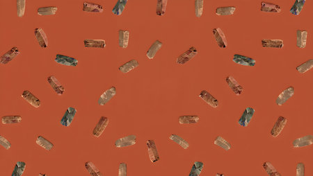 Pattern of colorful stones on orange background. Flat lay, top view.の素材