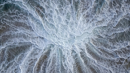 Aerial view of sea waves breaking on the beach. Top viewの素材