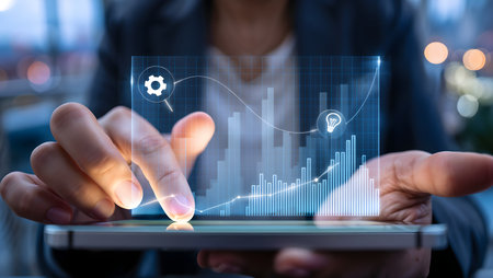 Businessman using a tablet with graph and chart concept 3D renderingの素材