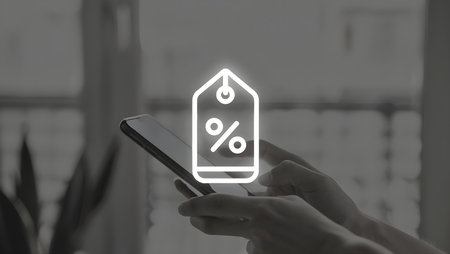 Discount tag icon on mobile phone screen. Online shopping concept.の素材