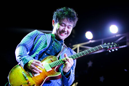 CHONBURI,THAILAND-FEBRUARY 16  The guitarist of Slot Machine band was showing his performance in Kasetsart University indy music concert 2014 at Kasetsart University Sriracha campus on Feb 16, 2014 in Chonburi,Thailand のeditorial素材