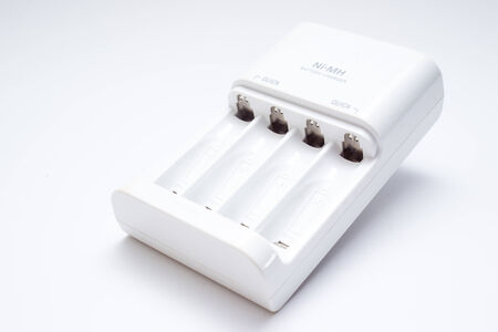 Battery charger in white background の写真素材