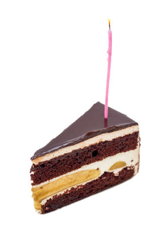 Chocolate cake with burning birthday candle.の写真素材