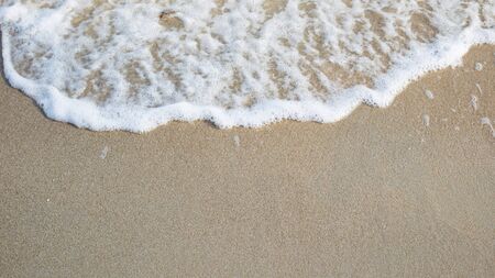 Sand and fresh sea wave background.の写真素材