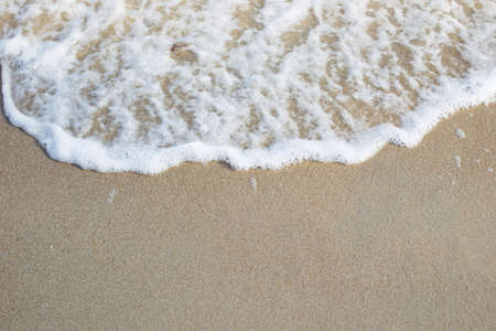 Sand and fresh sea wave background.の写真素材