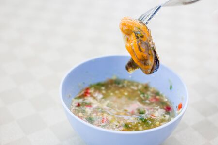 Cooked Muscles with Thai spicy seafood sauce.の写真素材