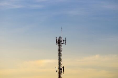 Radio tower in sunset sky.の写真素材