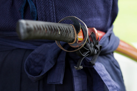 The treaditional Japanese sword Katana sword holding in Samurai hand prepare to flighting.の写真素材
