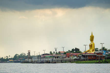 NONTHABURI,THAILAND-JULY 6: The landscape of traditional riverside city and the big buddha in Nonthaburi province taken on July 6,2015 in Thailand.のeditorial素材