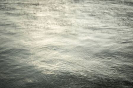 Blur of water in lake white raining.の写真素材