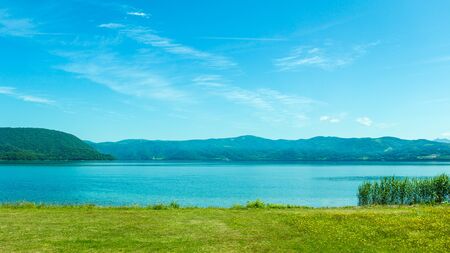 Beautiful lake and mountain in summer season in Hokkaido Japanの写真素材