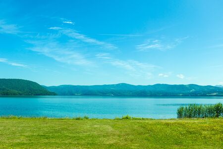 Beautiful lake and mountain in summer season in Hokkaido Japanの写真素材