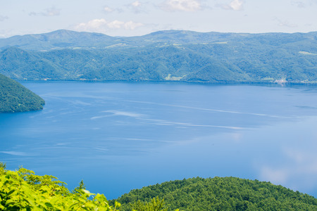Beautiful lake and mountain in summer season in Hokkaido Japanの写真素材