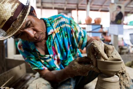 NONTHABURI,THAILAND-AUG 9: The traditional clay pot making in Koh Kred island by the professional clay pot maker taken on Aug 9, 2015のeditorial素材