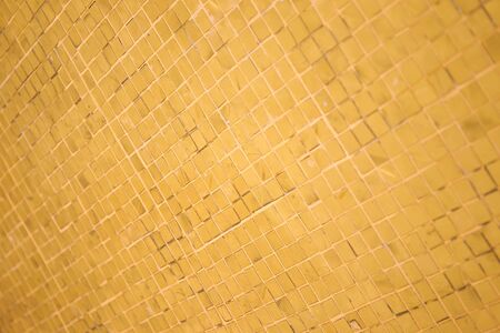 Golden wall in temple in Thailand close up background.の写真素材