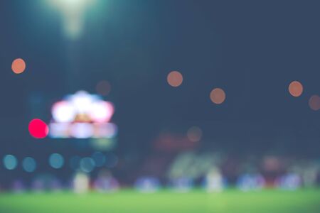 Blur of lighting from football stadim background.vintage colour tone filtered.のeditorial素材