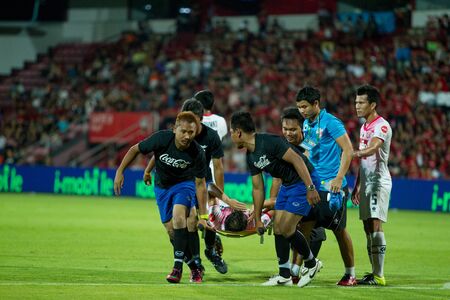 NONTHABURI,THAILAND-JULY 25: Injured player of Saraburi FC in first aids medic between the game MTUTD and Saraburi FC on July 25,2015 in Thailand.のeditorial素材