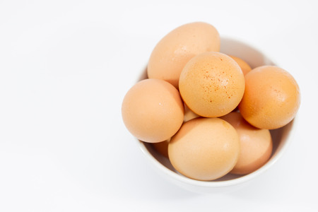 Eggs in bowl isolated.の写真素材