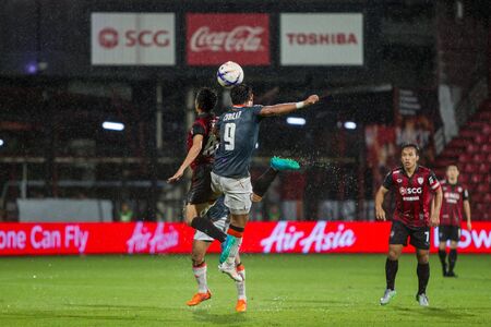 NONTHABURI,THAILAND-SEPTEMBER 23: Unidentified Players of SCG Muangthong United in action between the game MTUTD and Chaing Rai UTD in Chang FA Cup 2015 at SCG Stadium on Sep 23, 2015のeditorial素材