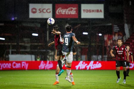 NONTHABURI,THAILAND-SEPTEMBER 23: Unidentified Players of SCG Muangthong United in action between the game MTUTD and Chaing Rai UTD in Chang FA Cup 2015 at SCG Stadium on Sep 23, 2015のeditorial素材