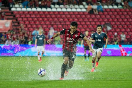 NONTHABURI,THAILAND-SEPTEMBER 23: Chananan Pombuppha(No.22) Players of SCG Muangthong United in action between the game MTUTD and Chaing Rai UTD in Chang FA Cup 2015 at SCG Stadium on Sep 23, 2015のeditorial素材