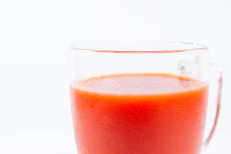 Image of fresh tomato juice close up isolated.の写真素材
