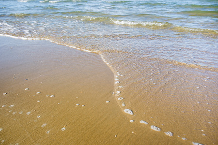Sea wave on beach close up background.の写真素材