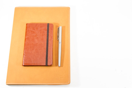 Classic leather notebook isolated in white background.の写真素材