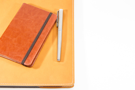 Classic leather notebook isolated in white background.の写真素材