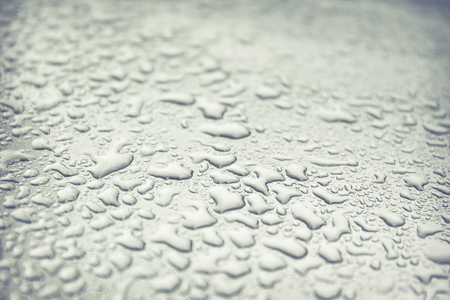Rain drop on car roof close up.(Processed in vintage colour tone)の写真素材