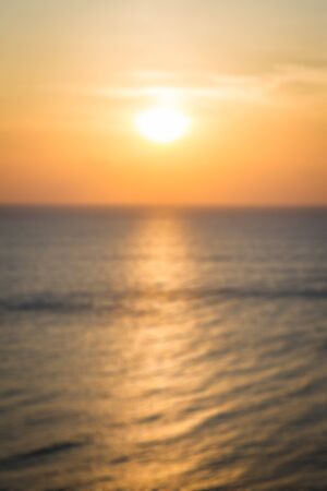 Blur image of ocean in sunset background.の写真素材