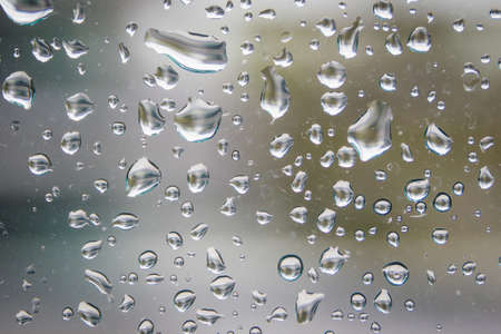 Rain drop on glass window background.の写真素材