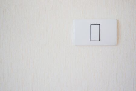 Home lighting switch on wall close up.の写真素材