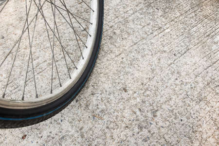 Old rusty bicycle wheels close up.の写真素材
