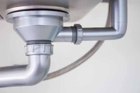 Dirty water pipe in kitchen.の写真素材