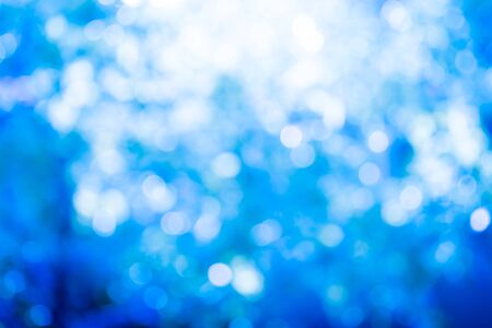 Abstract blur image of sun light in forest background.の写真素材