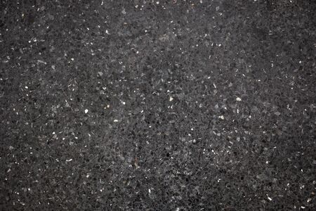 Dark black stone floor close up background.の写真素材