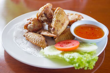 Traditional Thai fired chicken wing close up.の写真素材