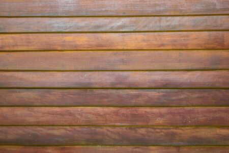 Brown wooden wall close up background.の写真素材