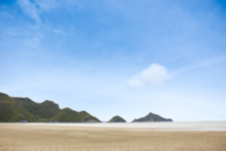 Blur image of beach and moutain view with beautiful blue sky background.の写真素材