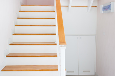 The modern wooden stair way in home close up.の写真素材