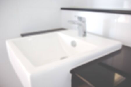 Blur image of Modern washbasin in bathroom  close up background.の写真素材