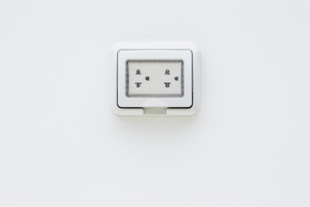 Electric plug socket with protection flip case close up.の写真素材