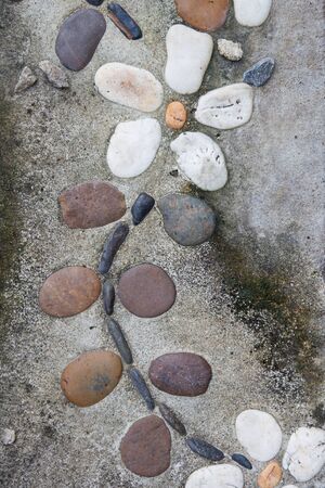 Native art, ceramic flowers on old concrete brick close up background.の写真素材